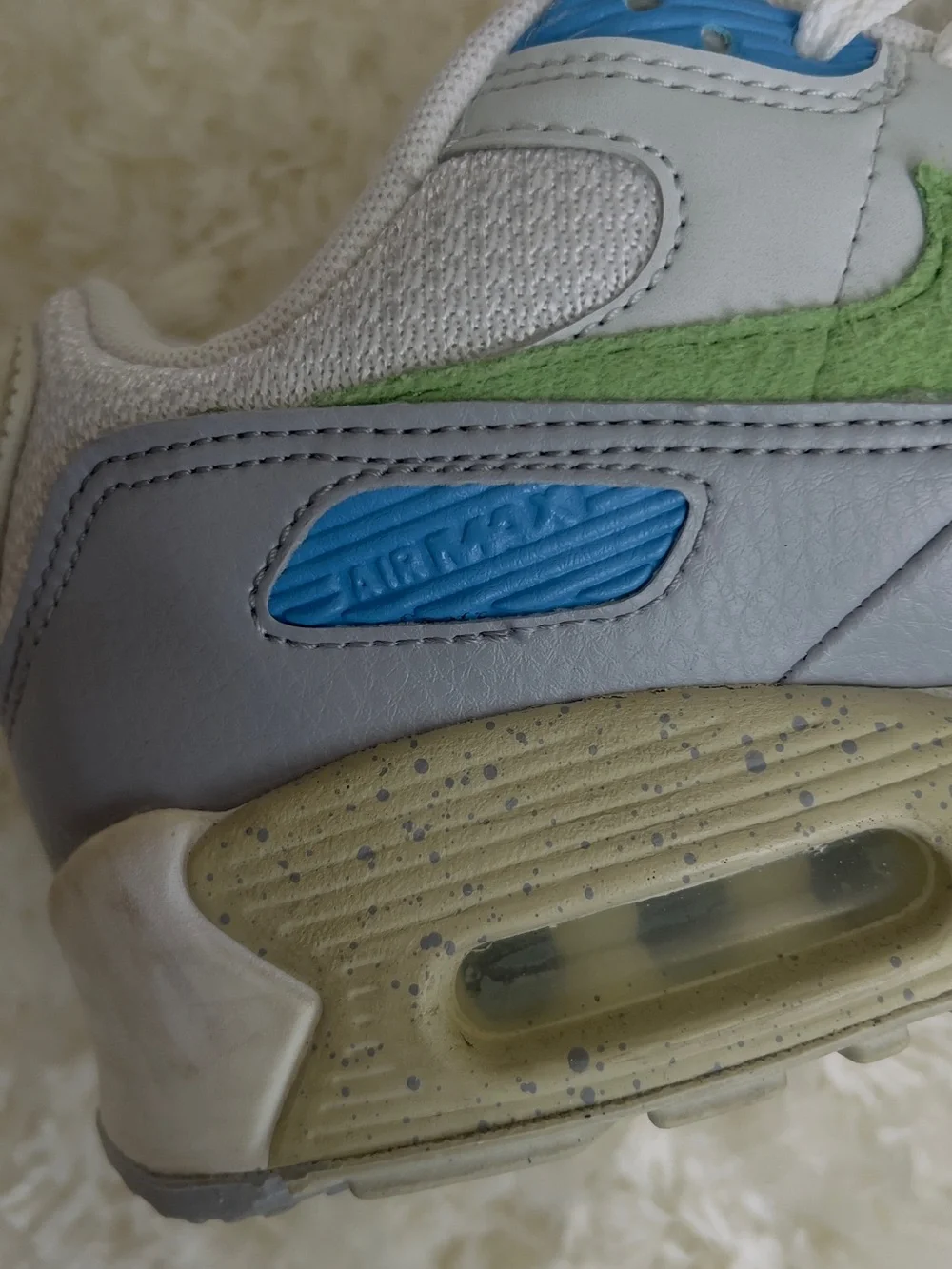Nike Air Max 90 sneakers in white with blue and green accents